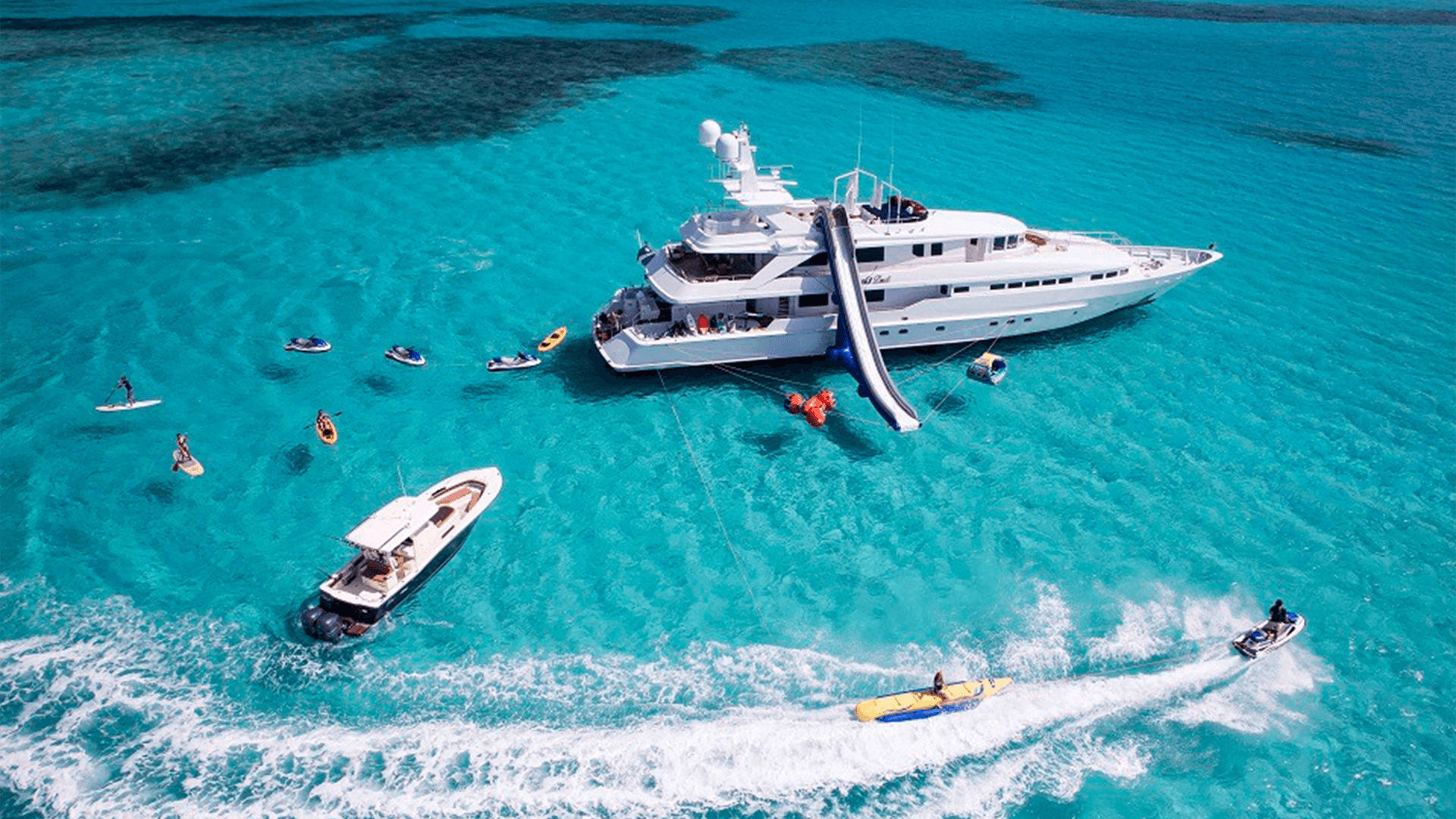 caribbean_yacht_charter_guests_using_jet_skis_and_paddle_boards_around_the_yacht